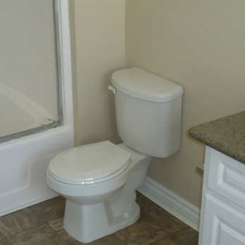 1st Choice Construction & Landscaping - a white toilet in a bathroom - General Contractors Near Me - Temecula, California 1st Choice Construction & Landscaping - a white toilet in a bathroom - General Contractors Near Me - Temecula, California