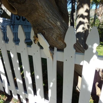Dan Scully's Tree Services - The picket fence broke, but provided some support. - Tree Services Near Me - La Crescenta, California