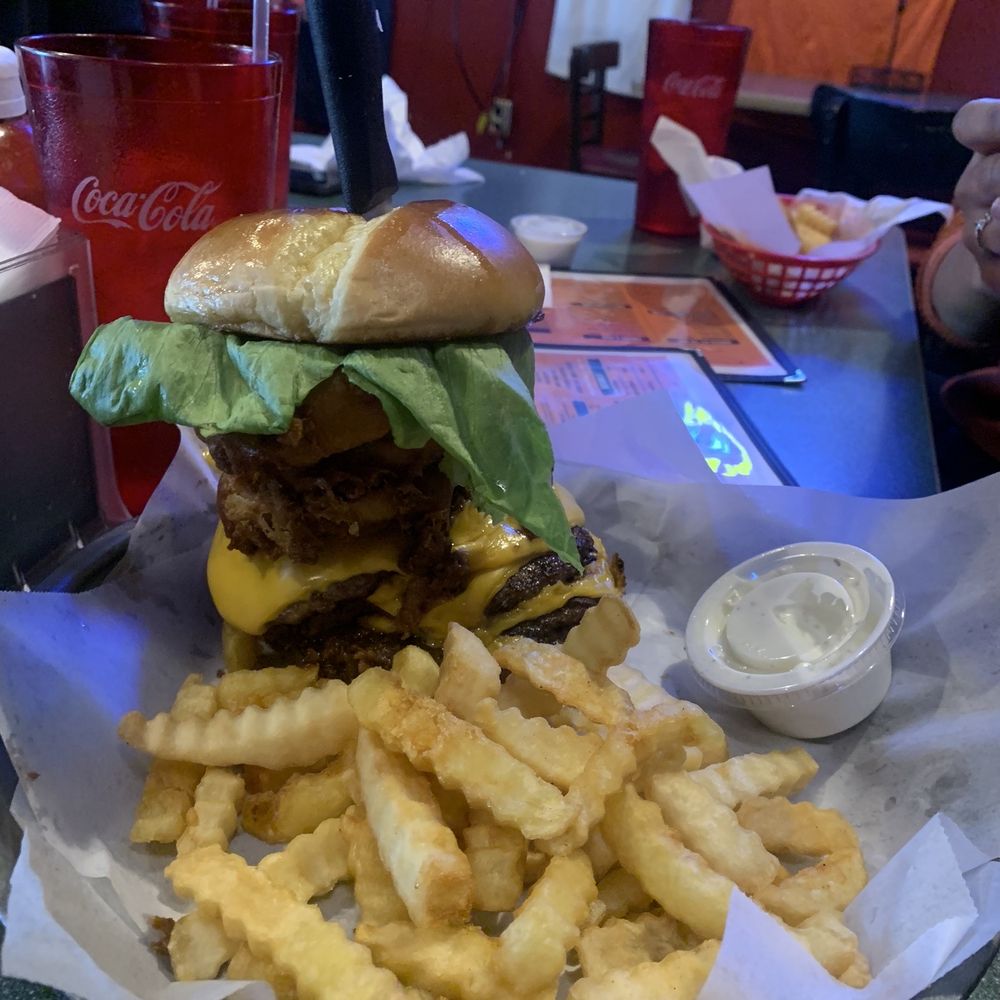 The Grille House - The Mega burger with double patties, pulled pork, bacon, and onion rings - Lounges Near Me - Albany, Georgia The Grille House - The Mega burger with double patties, pulled pork, bacon, and onion rings - Lounges Near Me - Albany, Georgia