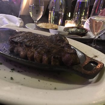 Positano Restaurant - Ribeye sizzling at the table. - Italian Near Me - Brooklyn, New York Positano Restaurant - Ribeye sizzling at the table. - Italian Near Me - Brooklyn, New York