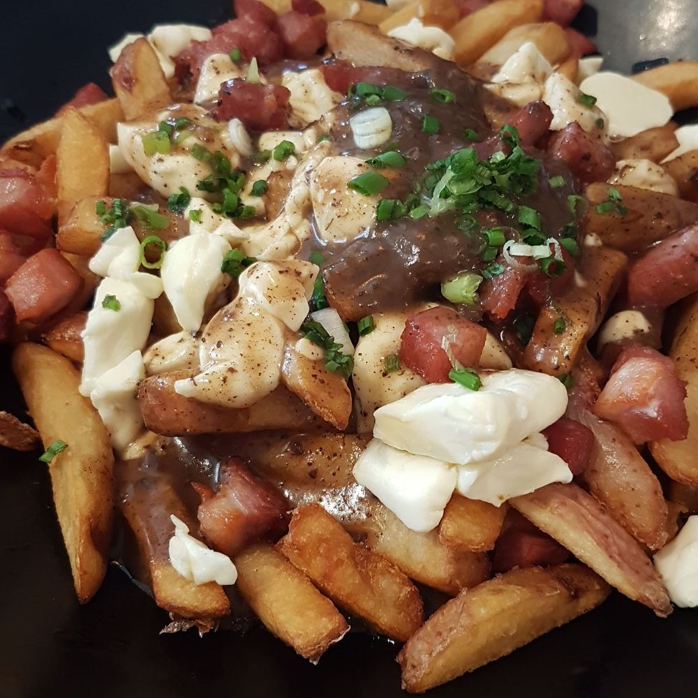 Cochon Dingue - Poutine with porcelette - Canadian (New) Near Me - Lévis, Quebec Cochon Dingue - Poutine with porcelette - Canadian (New) Near Me - Lévis, Quebec