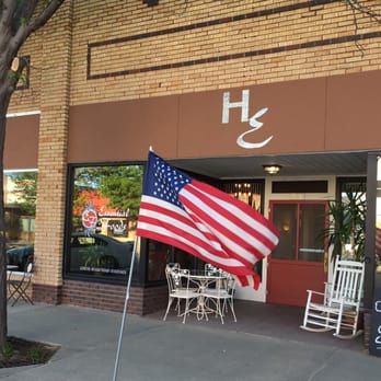 Health Essentials - an american flag in front of a store - Health Markets Near Me - Burlington, Colorado