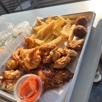 Safe Harbor Seafood - Blackened snapper, fried shrimp, fried oysters, fries, hush puppies, slaw. - Seafood Near Me - Jacksonville, Florida Safe Harbor Seafood - Blackened snapper, fried shrimp, fried oysters, fries, hush puppies, slaw. - Seafood Near Me - Jacksonville, Florida
