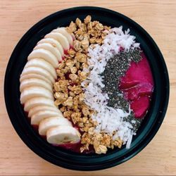Dragonfruit Bowl with Banana, granola, coconut, and chia seeds