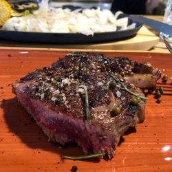Steakhouse Evil - 300g Ribeye, note the large platter of white onions in the background I elude to in my review.