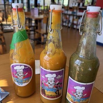 Hangry's - House made hot sauce. Middle is a pineapple mango habanero. The one with the green tape is not for mild sauce people! - Food Trucks Near Me - Norfolk, Virginia Hangry's - House made hot sauce. Middle is a pineapple mango habanero. The one with the green tape is not for mild sauce people! - Food Trucks Near Me - Norfolk, Virginia
