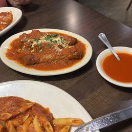 Penne pasta with a Ragú sauce and meatballs with a side of sausage. Delicious