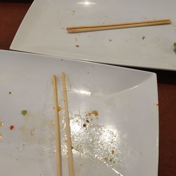 Kampai Sushi - chopsticks on a white plate - Japanese Near Me - Tucson, Arizona