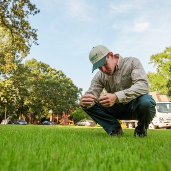 TruGreen Lawn Care - a man kneeling in the grass - Lawn Services Near Me - Chubbuck, Idaho TruGreen Lawn Care - a man kneeling in the grass - Lawn Services Near Me - Chubbuck, Idaho