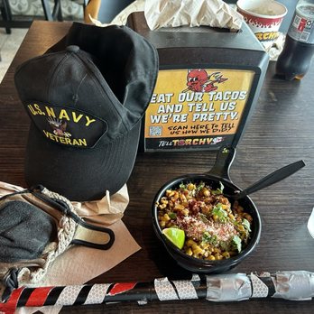 Torchy's Tacos - Interior: enclosed space adjacent to the sidewalk, showing my primary choice: "street corn" - Tex-Mex Near Me - Houston, Texas Torchy's Tacos - Interior: enclosed space adjacent to the sidewalk, showing my primary choice: "street corn" - Tex-Mex Near Me - Houston, Texas