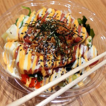 SPLASH POKE - a bowl of food with chopsticks - Hawaiian Near Me - Edmonton, Alberta SPLASH POKE - a bowl of food with chopsticks - Hawaiian Near Me - Edmonton, Alberta