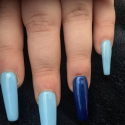 SpaRenity Nails & Organics - Here you can see none of these nails look to actually fit and how her cuticle's were left untouched.