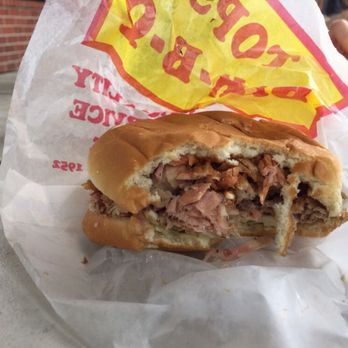 Tops Bar-B-Q - Pardon the bite marks, it's the pulled pork sandwich. - Barbeque Near Me - Millington, Tennessee Tops Bar-B-Q - Pardon the bite marks, it's the pulled pork sandwich. - Barbeque Near Me - Millington, Tennessee