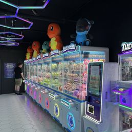 One of two walls of claw machines