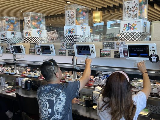 Kura Revolving Sushi Bar by null