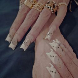 Project Red Salon - Gel X set with moon free edge, hand painted embellishments and a golden, dangling hoop on the pinkies