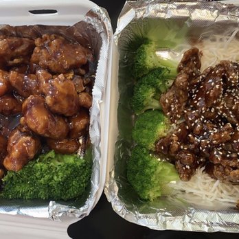 Bamboo House - Orange chicken on the left, crispy beef on the right Both very delicious! Comes with white or fried rice - Sushi Bars Near Me - Euless, Texas