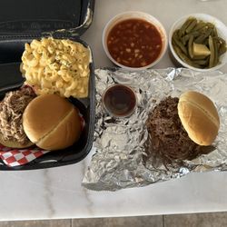 Pulled pork sandwich, Mac and cheese, bbq beans, brisket sandwich, bbq sauce, and green beans.
