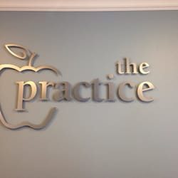 Tebay Andrew, DDS - Logo above the reception desk.