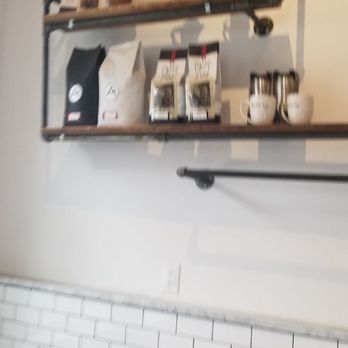 Caffè Ammi Roasting - Cool pipes hold up the shelves. - Coffee Roasteries Near Me - Pelham, New York