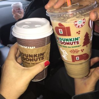 Dunkin' - two people holding cups of coffee - Coffee & Tea Near Me - Twinsburg, Ohio Dunkin' - two people holding cups of coffee - Coffee & Tea Near Me - Twinsburg, Ohio
