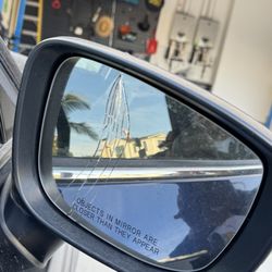 Bravo's Auto Body - cracked rear view mirror, passenger side