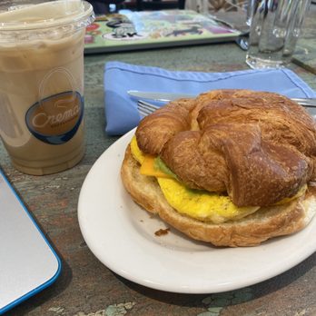 Crema Coffeehouse - Egg and cheese sandwich with avocado and an iced latte - Coffee & Tea Near Me - Saint Louis, Missouri Crema Coffeehouse - Egg and cheese sandwich with avocado and an iced latte - Coffee & Tea Near Me - Saint Louis, Missouri