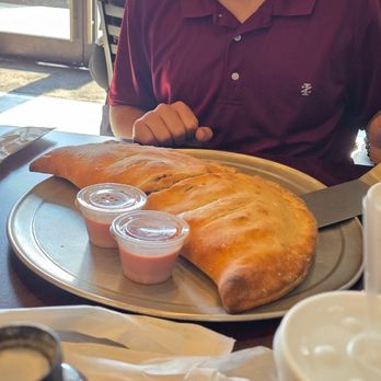 Serafina’s Pizzeria - Calzone for 2 (adults) thing was massive! - Pizza Near Me - St Johns, Florida Serafina’s Pizzeria - Calzone for 2 (adults) thing was massive! - Pizza Near Me - St Johns, Florida