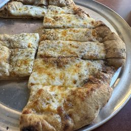 Half of the cheesy bread Half of the cheesy bread