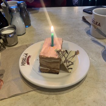 Veselka - Chocolate mousse cheesecake (with birthday candle) - Ukrainian Near Me - New York, New York Veselka - Chocolate mousse cheesecake (with birthday candle) - Ukrainian Near Me - New York, New York