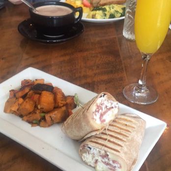 Pure Bistro - "Usual" wrap with turkey bacon, egg whites and Swiss cheese. Sweet potato home fries and mimosa. - Juice Bars & Smoothies Near Me - Brooklyn, New York