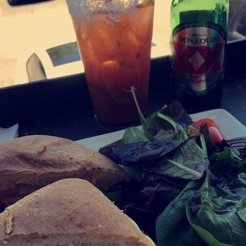 Halcyon - Spicy Southtown chicken sandwich (Chicken, avocado, tomato, bacon and I believe chipotle sauce) with a side salad & a delicious michelada. - Coffee & Tea Near Me - San Antonio, Texas