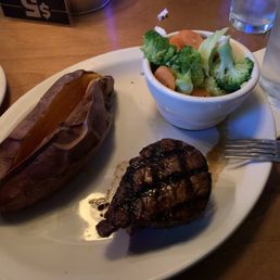 Filet Mignon, baked sweet potato, and steamed vegetables. Filet Mignon, baked sweet potato, and steamed vegetables.