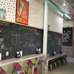 Square Scoops Coffee & Creamery - Black boards with different height chairs