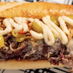 Front Street Food Trucks - "The Yoda" Smoked ribeye, melted white cheddar, crispy onions, and garlic aioli on a fresh-baked baguette. Pure flavor wizardry.