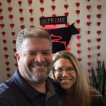 16 Prime Steak & Seafood - Us in front of the Valentine's Day decorations at 16 Prime. - Steakhouses Near Me - Denver, North Carolina