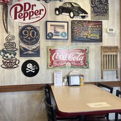 Kenny's Oak Grill - Table seating with fun, diner wall decor