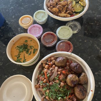 Sumac - Assortment of side sauces , meatball bowl and chicken bowl ; pepper hummus - Mediterranean Near Me - San Francisco, California