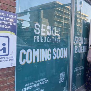 Seoul Fried Chicken - a woman standing in front of a window - Chicken Wings Near Me - Calgary, Alberta Seoul Fried Chicken - a woman standing in front of a window - Chicken Wings Near Me - Calgary, Alberta