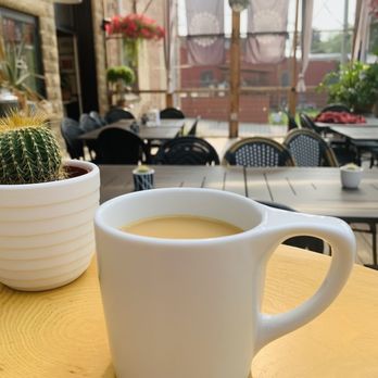 Horseradish - a cup of coffee on a table - Sandwiches Near Me - Princeton, Wisconsin