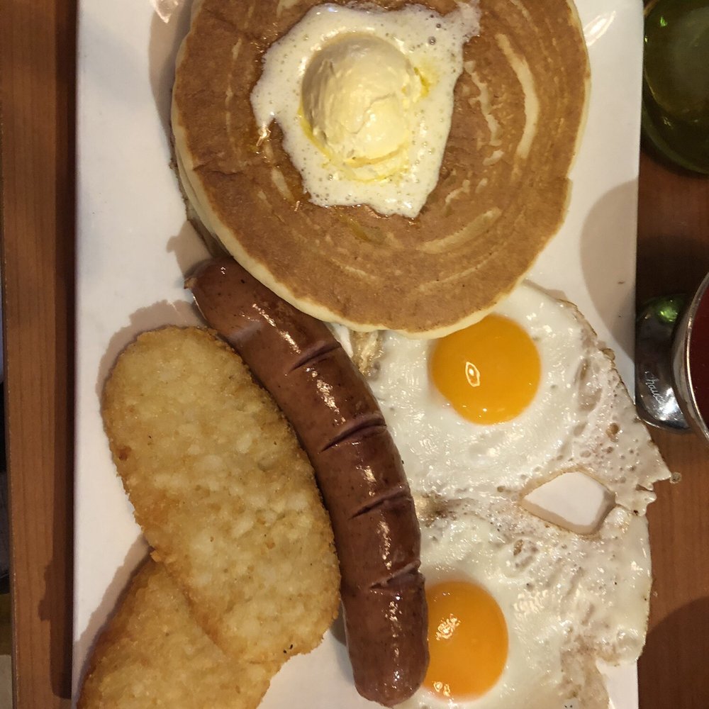 Two eggs, two hashbrowns, two pancakes and supposed to be two sausage but I got Kranski sausage. Two eggs, two hashbrowns, two pancakes and supposed to be two sausage but I got Kranski sausage.