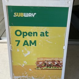 a subway sign with a sandwich on it a subway sign with a sandwich on it