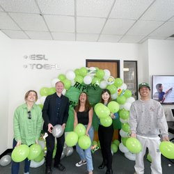 Lasc - Students joyfully waving green balloons to celebrate Saint Patrick's Day at LASC LA Campus!