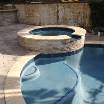 Trinity Custom Pools - New coping, stacked stone, concrete. Added steps and Aqua white mini pebble - Pool & Hot Tub Service Near Me - Riverside, California Trinity Custom Pools - New coping, stacked stone, concrete. Added steps and Aqua white mini pebble - Pool & Hot Tub Service Near Me - Riverside, California