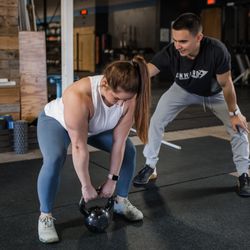 Onward Physical Therapy - A physical therapist working with a  patient on strengthening exercises at Onward Physical Therapy Frederick.