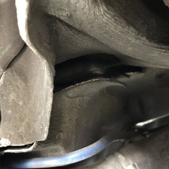 Driven Garage - BEFORE: You can see the metal is ripped and splitting from the rest of the car. - Auto Repair Near Me - Hayward, California
