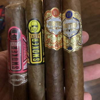 Marmol Cigars Boutique Store - a hand holding a sample of marmol - Tobacco Shops Near Me - Jacksonville, Florida Marmol Cigars Boutique Store - a hand holding a sample of marmol - Tobacco Shops Near Me - Jacksonville, Florida