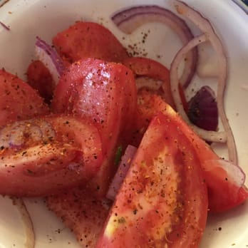El Palomar - Tomato wedge salad with tajin. - Bars Near Me - San Miguel, ROO El Palomar - Tomato wedge salad with tajin. - Bars Near Me - San Miguel, ROO