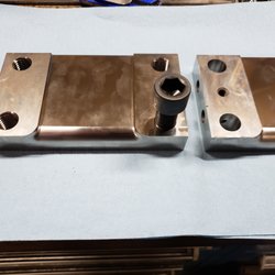 Bull Moose Engineering & Manufacturing - These parts had to have 3/8x16 threaded holes and clearance holes enlarged to 3/4x10. The material is D2 hardness HRC 60. The bolt in the