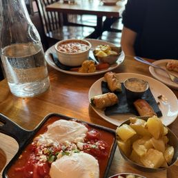 Shakshouka (front), artichoke strata (back)